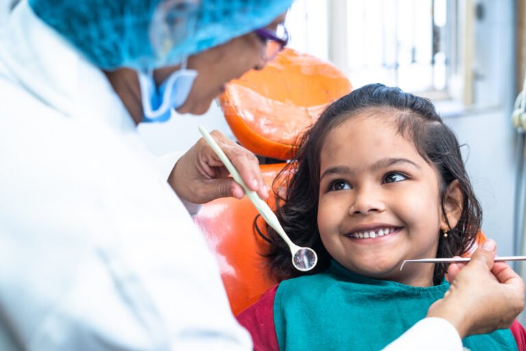 Young patient smiling in the dental chair
